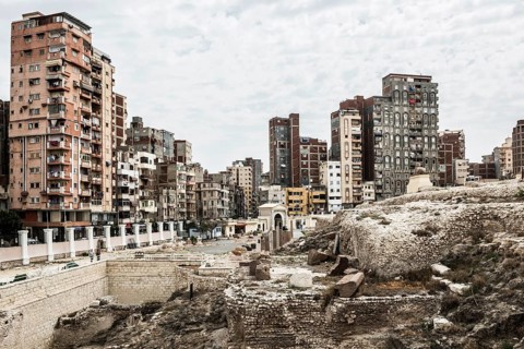 Roman archaeological site in the middle of the city and skyscrapers, Pompey's Column, Alexandria,