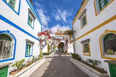 Puerto de Mogan typical colorful houses with flowers on Gran Canaria island vacation trip in Puerto