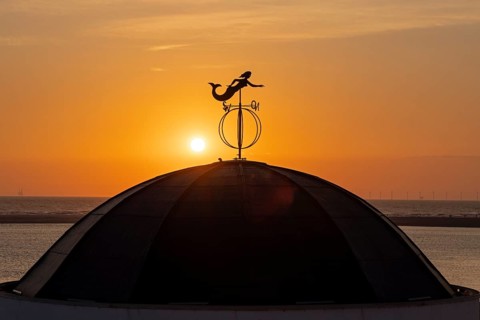 Mermaid on the roof, sunset, beach pavilion, Borzburg, East Frisia, Lower Saxony, Germany