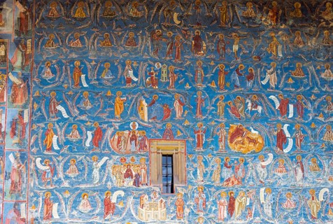Blue dominated wall with numerous holy icons and elaborate frescoes, exterior view, Saint George