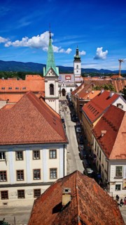 View from Lotrscak Tower towards the cathedral, panoramic view of city with church tower and red