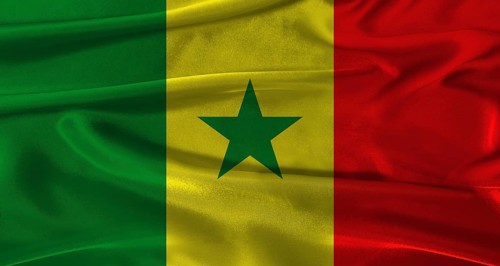 Flag of Senegal with fabric textured background. Close up of National flag of Senegal with
