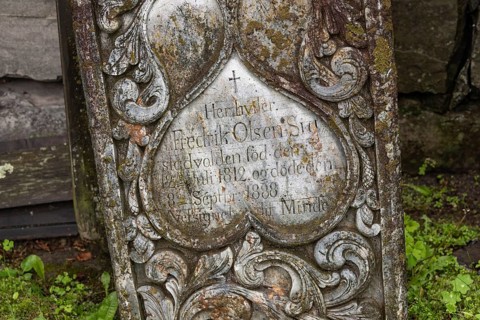 Old gravestone at cemetery, wooden church, Kvam, upper Gudbrandsdalen valley, Norway
