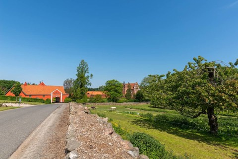 Late Gothic manor house Hesselagergaard, street, fruit trees, farm buildings, entrance gate, 16th