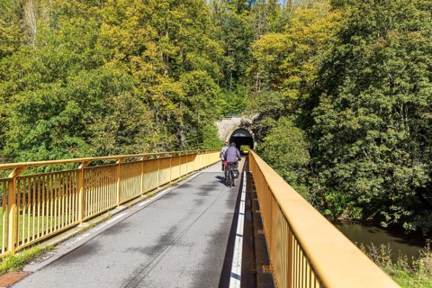 Cyclist on the Chemnitz valley cycle path with Schusterstein tunnel, Chemnitz, Saxony, Germany