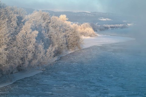 Fog over the freezing river Glomma (Glåma), Alvdal, Hedmark, Innlandet, Norway, February 2026
