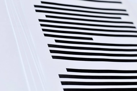 Close up of documents with fully blacked out text. Censorship secrecy and hidden information