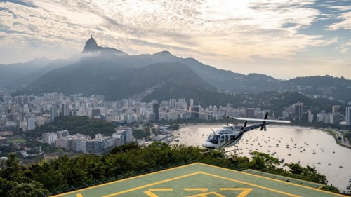 Helicopter lands on Sugar Loaf Mountain, Praia de Botafogo, Rio de Janeiro, Brazil