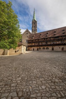 20 August 2026, The historic cobblestone courtyard of Alte Hofhaltung with the Bamberg Cathedral