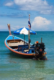 Typical Thai longtail boat on Bang Tao Beach in the northwest of the holiday island Phuket,