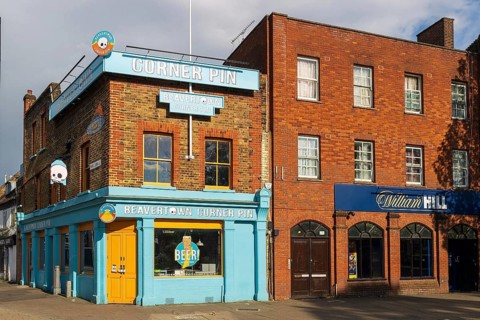 The brightly painted Corner Pin pub, run by Beavertown Brewery, stands on the corner near the