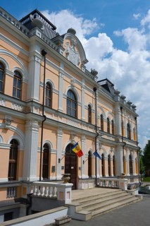An impressive historic building with entrance area and national flags, Manuc Bey Castle, Hîncesti,