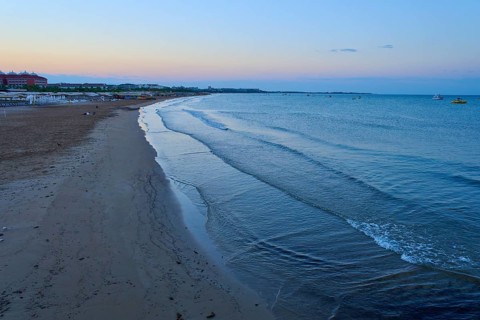 Empty beach in the morning with gentle waves and calm atmosphere, Evrenseki, Manavgat, Antalya,
