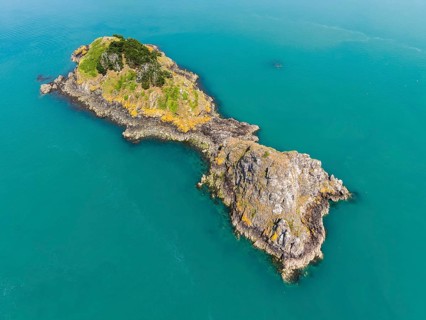 Aerial view of the distinctive rock formation and tidal island of Pointe de la Chaîne on the