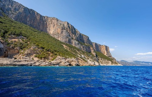 Picturesque rocky coast, cliffs and blue sea, Golfo di Orosei, Baunei, Sardinia, Italy
