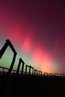 Northern lights (aurora borealis) over the ring sanctuary of Pömmelte, prehistoric circular ditch