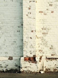 Detailed view of an old brick and weathered Langerhallen façade in the evening light, Bremerhaven,