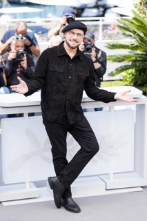 John Travolta photocall for Propeller One-Way Night Coach at the Palais des Festivals et des