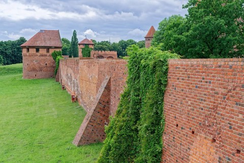 Castle wall and external fortifications of Malbork. The Malborku Castle, Zamek w Malborku, is a