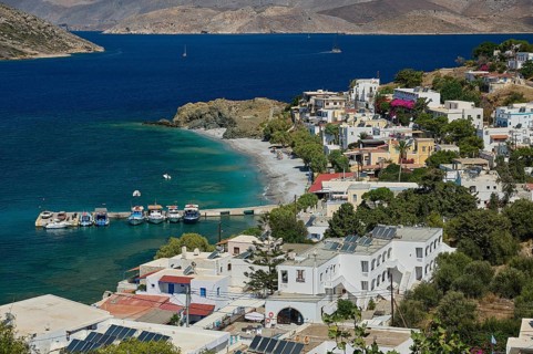 Myrties, Mirteai, small port with boats on the coast of a lively village and hilly landscape,