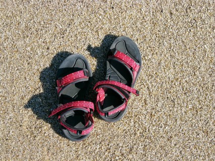 Red sandals on sand, hiking, trekking sandals, sandy beach, North Sea, view from above, Sylt,