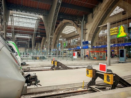 Modern track areas of a train station with covered glass roofs, train station, Leipzig main station