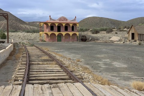 Railway tracks and saloon in the western village of Fort Bravo or Texas Hollywood, Almeria, Spain