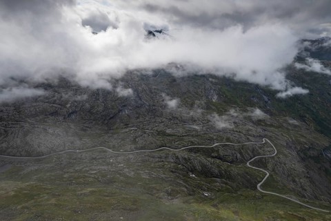 Famous curvy mountain road Fylkesvei 63 or Geirangervegen, which leads from Geiranger to the