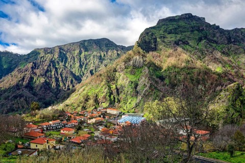 Curral das Freiras surrounded by mountains, parish of the district of Câmara de Lobos, tourist