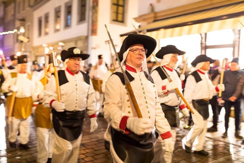 Mining parade through the old town centre of Freiberg, Erzgebirge, Saxony, Germany