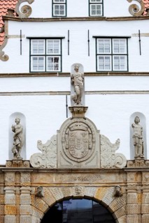 Torhaus am palace gardens, façade with figure and coat of arms, Husum, North Frisia,