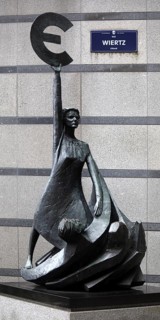 The bronze statue entitled Europe by May Claerhout holds up the euro symbol, Rue Wiertz, European