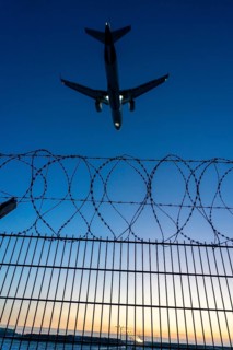 Symbolic image security at the airport, outer fence at Düsseldorf International Airport, steel wire