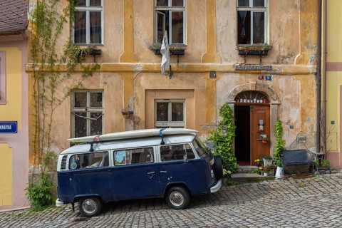 One van Volkswagen Bulli T2 standing in front of the Lazy River Hostel in Loket, Czech Republic