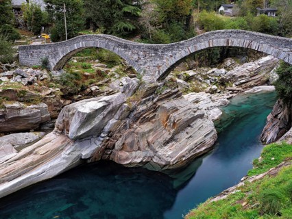 Historic Ponte dei Salti with double arches, Roman bridge, over the Verzasca river, Verzasca