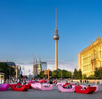 Pink and red plastic furniture for sitting and lying in front of the Humboldt Forum, Berlin,