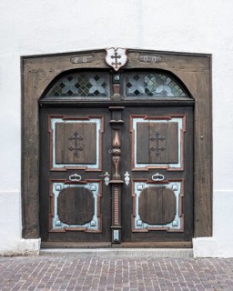 Historic artistically decorated hoztür, portal of the Holy Spirit Hospital in the old town of