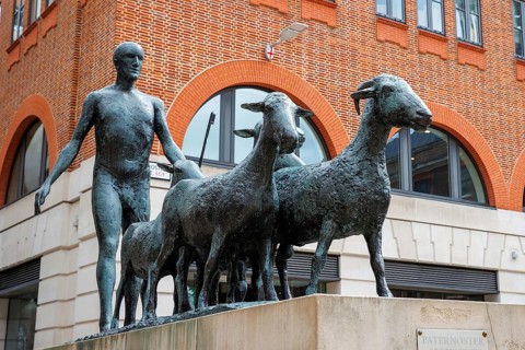 Elisabeth Frink's 1975 bronze sculpture of a shepherd and five sheep stands in Paternoster Square
