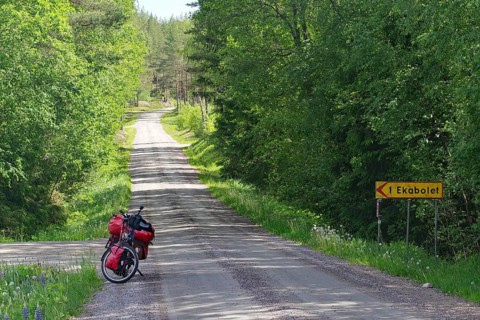 Bicycle parked on remote road in forest, Götaleden, Forsvik, Västra Götalands län, Sweden