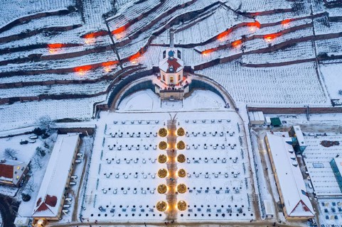 Aerial view of the Belvedere in Wackerbarth Castle Park with vineyards under snow and Christmas