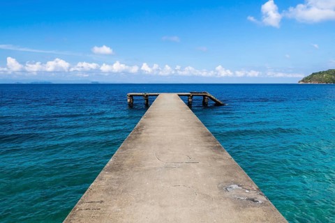 Small broken jetty on a tropical island in the marine park. Malaysia