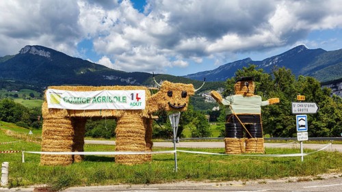 Two funny straw dolls made of bales of straw, figures, farmer, farmer with cow, Savoie,