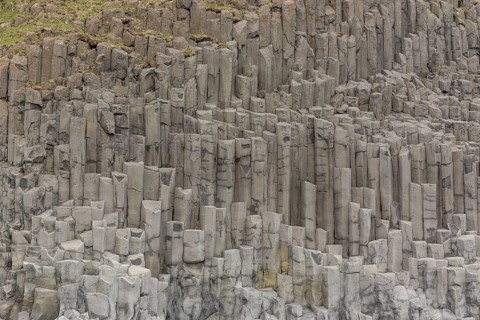 Reynisfjara Beach with Basalt rocks (Stuolabrrg) and the rock needles (Haidrangur), close to Vik i