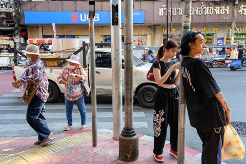 Bangkok, Thailand. February 18th 2025. Young and old, modern and traditional along Yaowarat Road,