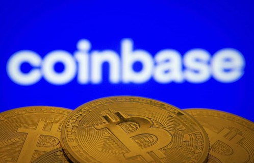Dhaka, Bangladesh- 16 June 2025: Close-up of Bitcoin coins with the Coinbase logo visible on a