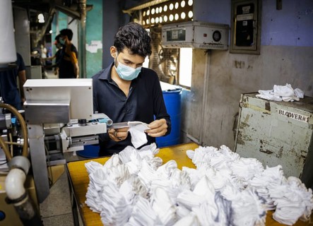 Employees of Inter Market Knit Private Limited producing socks. Lahore, 22.08.2024. Photographed on