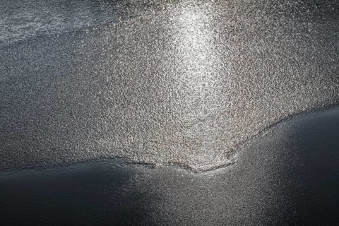 Frozen lake, structures of the water surface