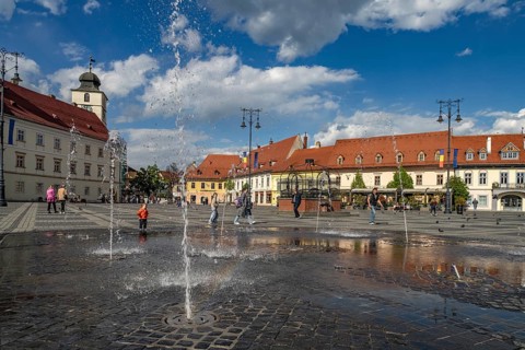 Fountain on the Pia?a Mare Grand Ring in the old town of Sibiu or Sibiu, Transylvania, Romania