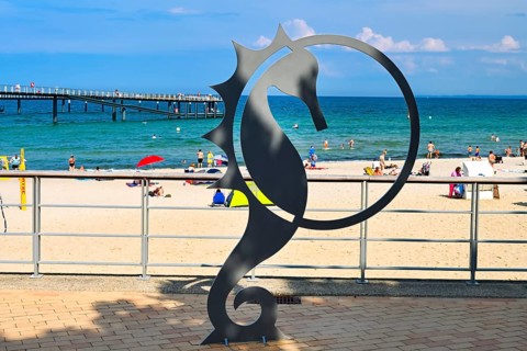 Seahorse figurine, landmark of Timmendorfer Strand, on the pier forecourt at the Maritim pier,