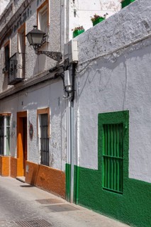 Small alley with colourful house facades, Rota, Andalusia, Spain